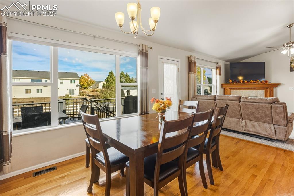 8449 Copenhagen Road Peyton, CO 80831 - Photo 22 of 49 a view of a dining room with furniture window and wooden floor