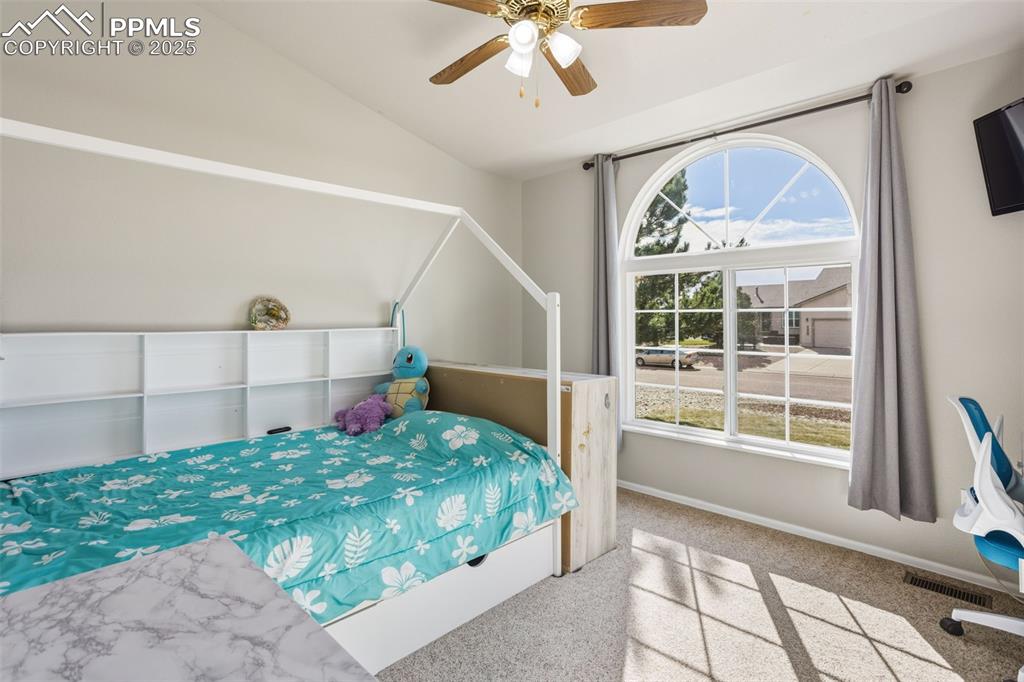 8449 Copenhagen Road Peyton, CO 80831 - Photo 27 of 49 a bedroom with a bed and a window