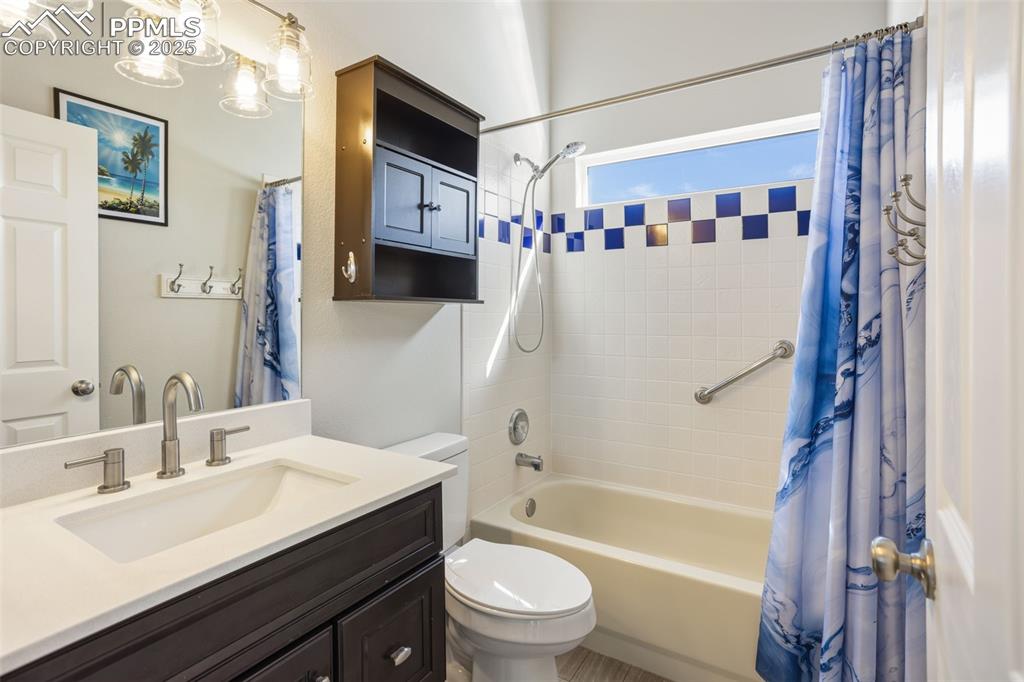 8449 Copenhagen Road Peyton, CO 80831 - Photo 28 of 49 a bathroom with a sink a toilet and a bathtub