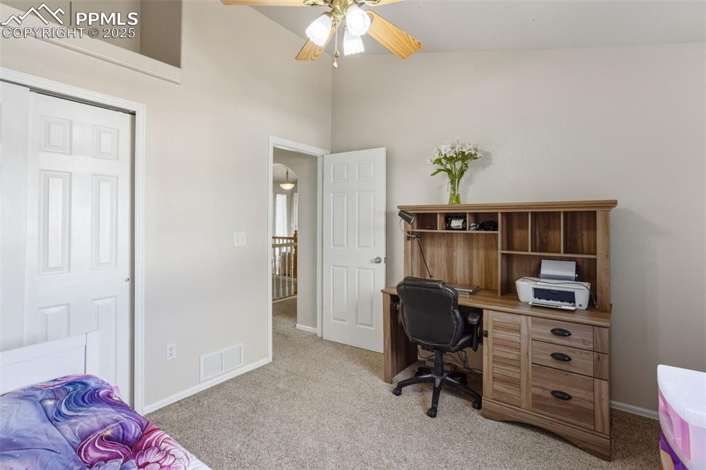 8449 Copenhagen Road Peyton, CO 80831 - Photo 30 of 49 a view of a workspace with furniture and a window