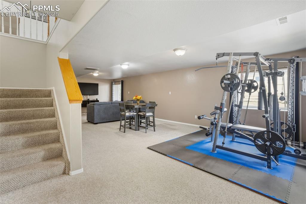8449 Copenhagen Road Peyton, CO 80831 - Photo 31 of 49 a view of a livingroom with furniture and a floor to ceiling window