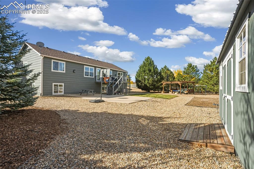 8449 Copenhagen Road Peyton, CO 80831 - Photo 45 of 49 a view of a house with snow on the road