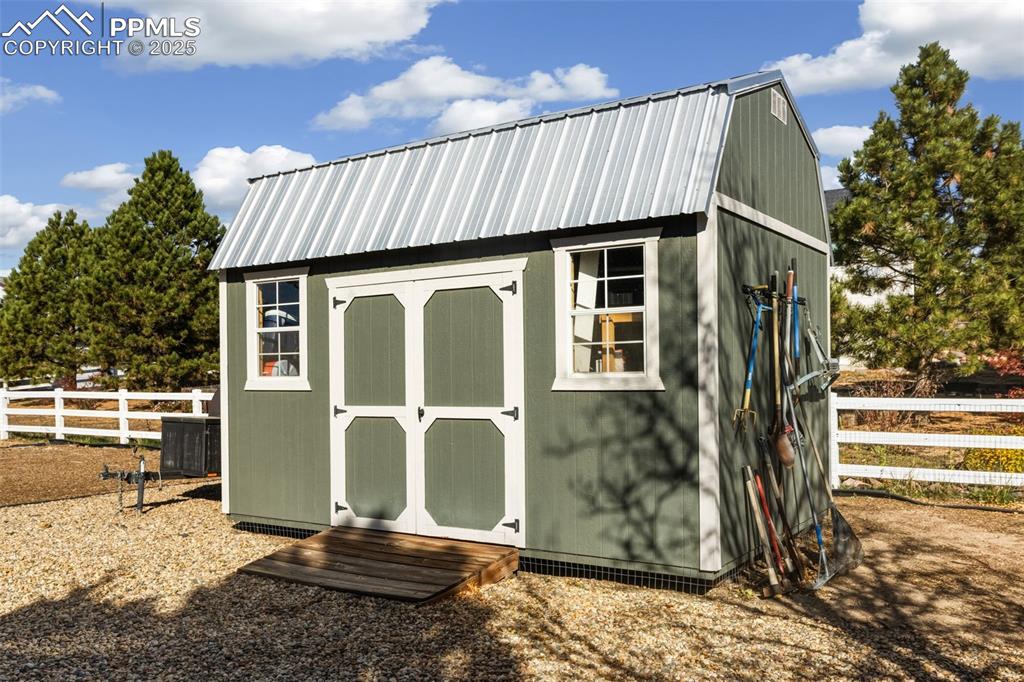 8449 Copenhagen Road Peyton, CO 80831 - Photo 46 of 49 a front view of a house with a yard