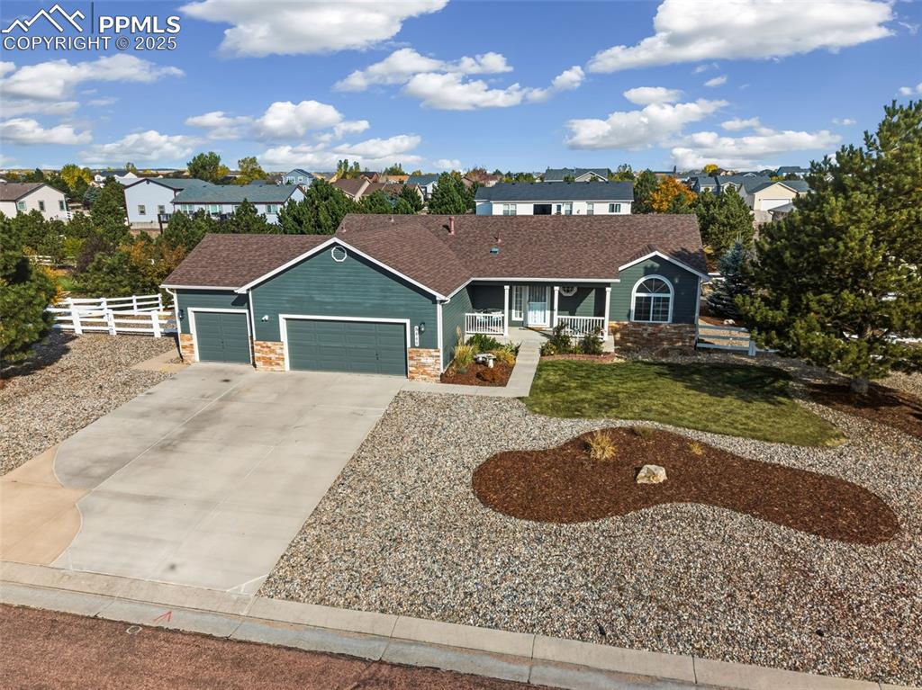 8449 Copenhagen Road Peyton, CO 80831 - Photo 6 of 49 front view of a house with a yard