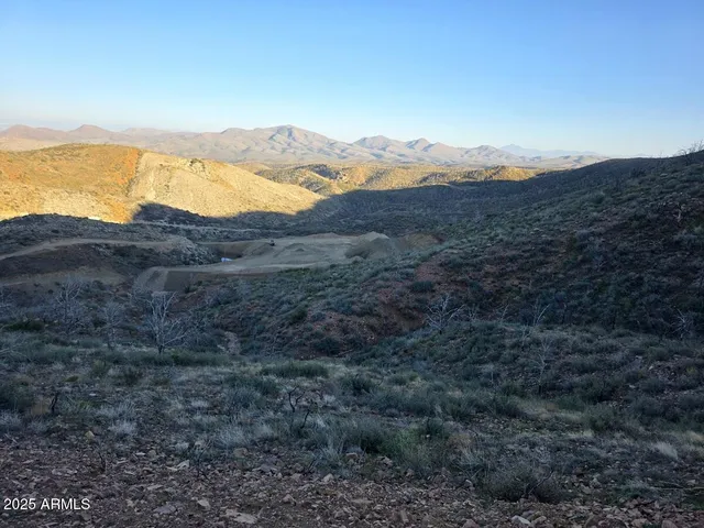 a view of a mountain range with mountains
