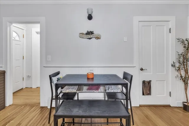 a view of a workspace with furniture and wooden floor