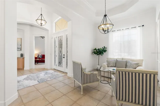 a kitchen with granite countertop white cabinets and stainless steel appliances