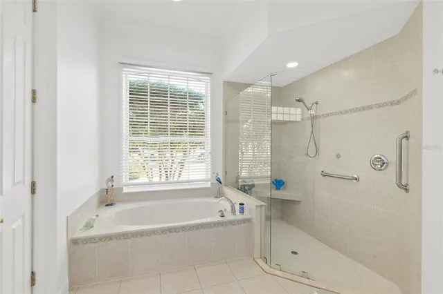 a bedroom with a bed and a wall painting