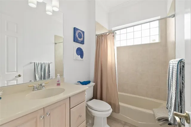 a view of a swimming pool with a patio and a yard