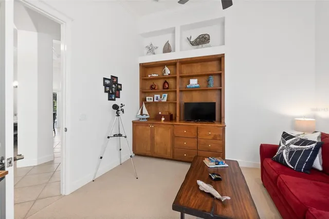 a living room with lots of furniture and a chandelier