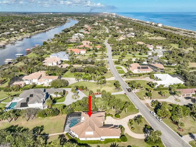 a view of a backyard with sitting area