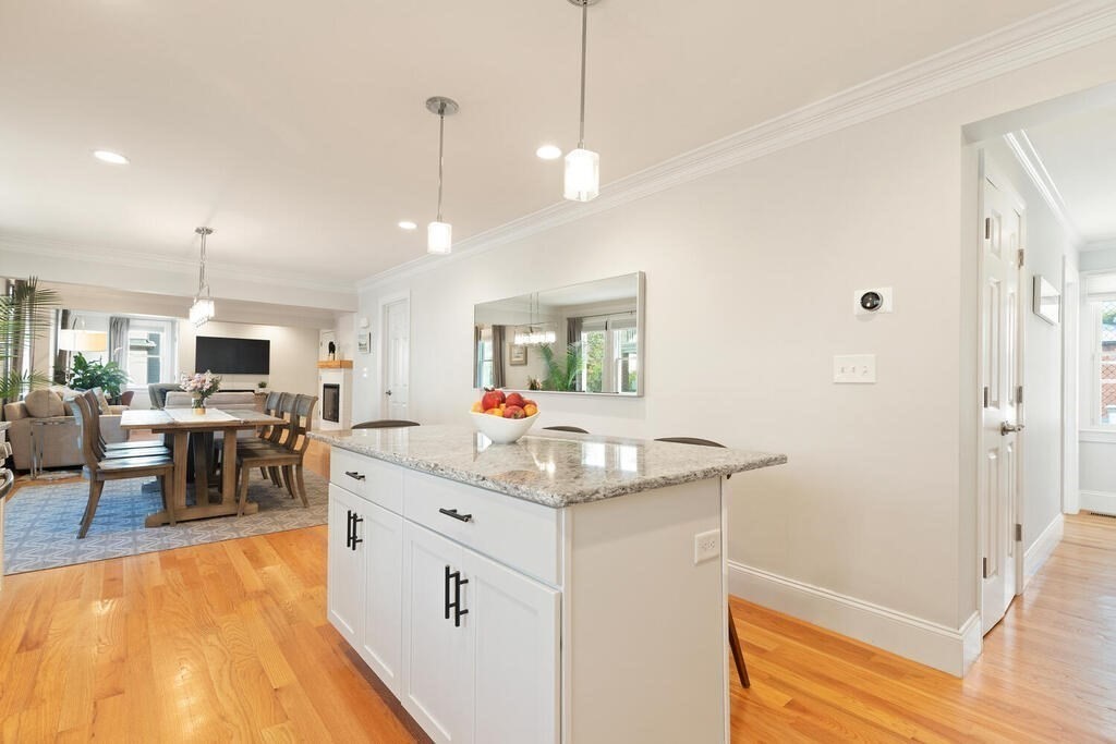 19 Foster Street, Unit 19 Arlington, MA 02474 - Photo 14 of 33 a kitchen with stainless steel appliances granite countertop a sink and a refrigerator