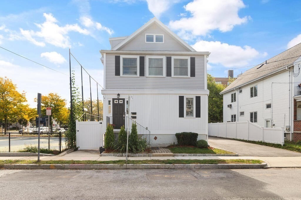 19 Foster Street, Unit 19 Arlington, MA 02474 - Photo 31 of 33 a front view of a house with a yard