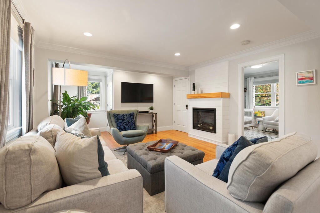 19 Foster Street, Unit 19 Arlington, MA 02474 - Photo 8 of 33 a living room with furniture and a fireplace