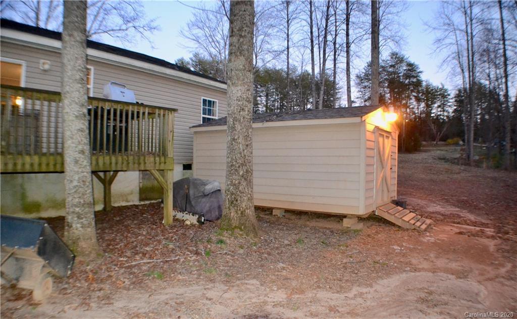 115 Cold Springs Drive Mill Spring, NC 28756 - Photo 17 of 19 a view of a house with backyard and sitting area