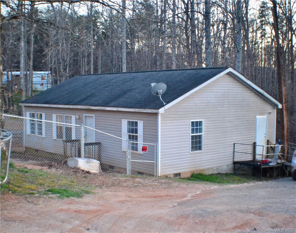 115 Cold Springs Drive Mill Spring, NC 28756 - Photo 19 of 19 a view of a house with a yard