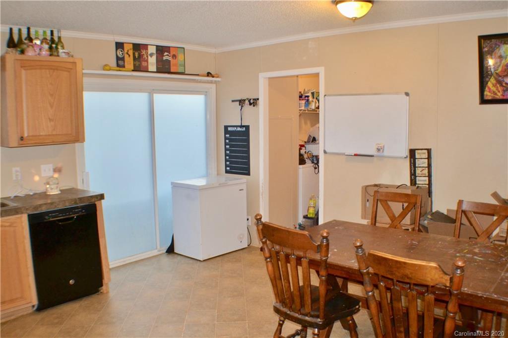 115 Cold Springs Drive Mill Spring, NC 28756 - Photo 7 of 19 a view of a dining room with furniture