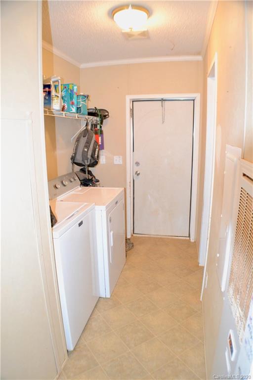 115 Cold Springs Drive Mill Spring, NC 28756 - Photo 8 of 19 a view of walk in closet with clothes and shoes