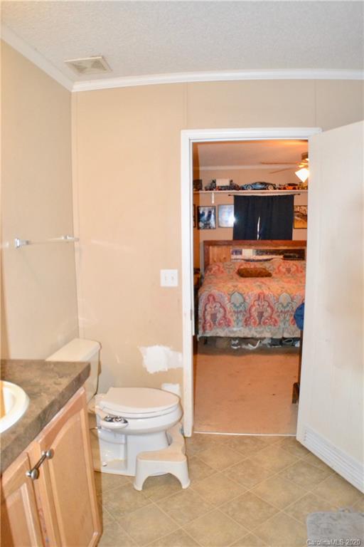 115 Cold Springs Drive Mill Spring, NC 28756 - Photo 9 of 19 a living room with a table and chairs