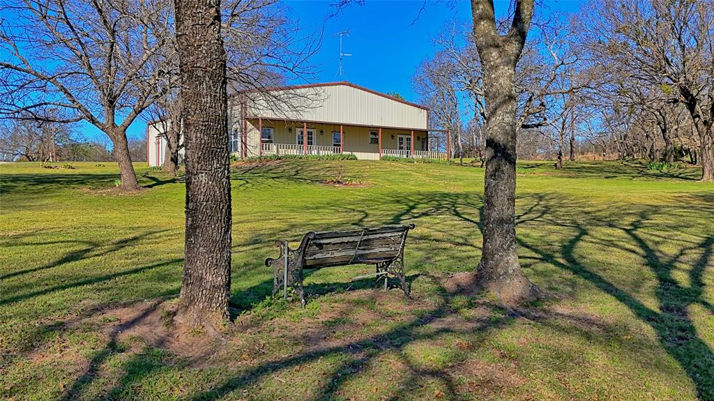 306 Dye Church Road St. Jo, TX 76265 - Photo 2 of 29 a view of a house with a yard