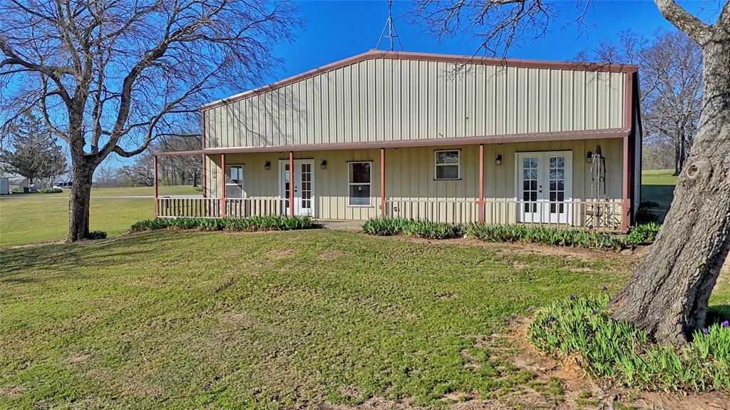 306 Dye Church Road St. Jo, TX 76265 - Photo 23 of 29 a front view of a house with a garden