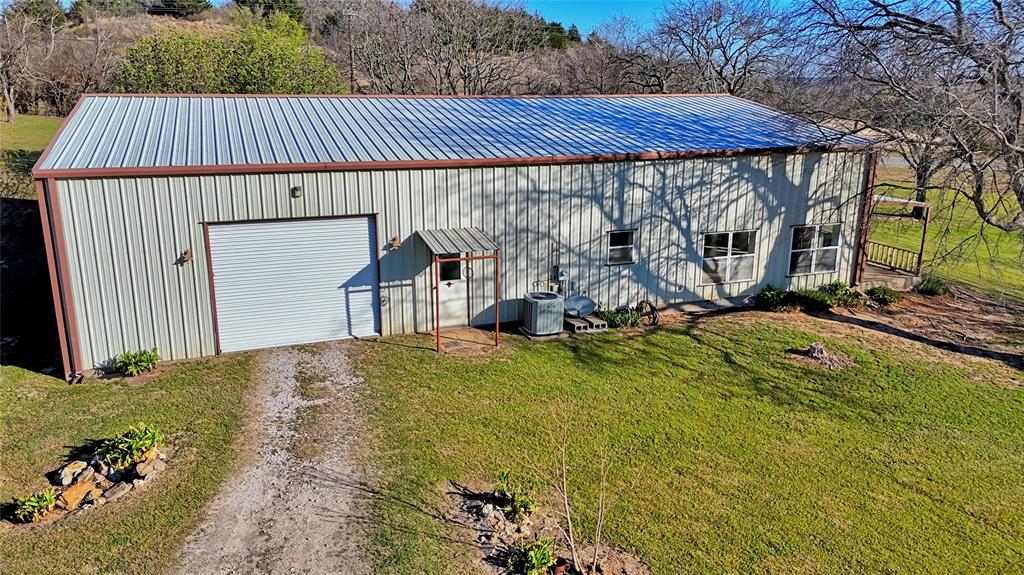 306 Dye Church Road St. Jo, TX 76265 - Photo 25 of 29 a view of a backyard with wooden fence