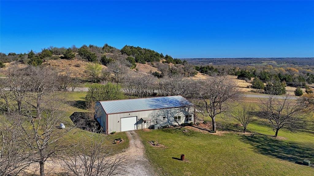 306 Dye Church Road St. Jo, TX 76265 - Photo 26 of 29 an aerial view of a house with a yard