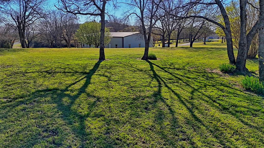 306 Dye Church Road St. Jo, TX 76265 - Photo 27 of 29 a view of a yard with plants and trees