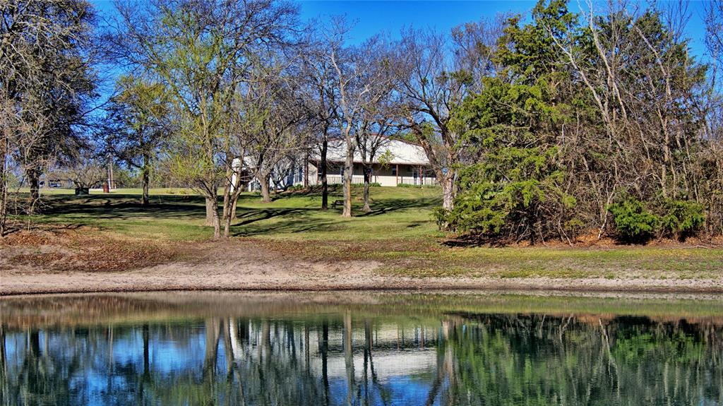 306 Dye Church Road St. Jo, TX 76265 - Photo 3 of 29 a view of a yard with wooden fence