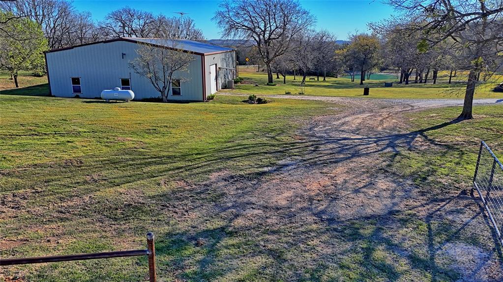 306 Dye Church Road St. Jo, TX 76265 - Photo 4 of 29 a view of a big yard with a house