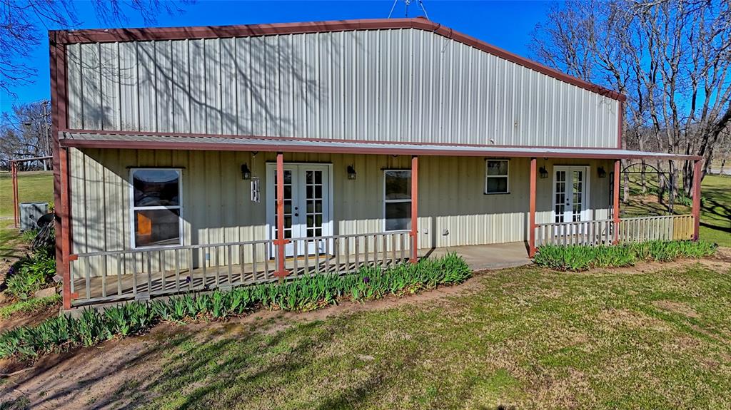 306 Dye Church Road St. Jo, TX 76265 - Photo 10 of 29 a front view of a house with a garden
