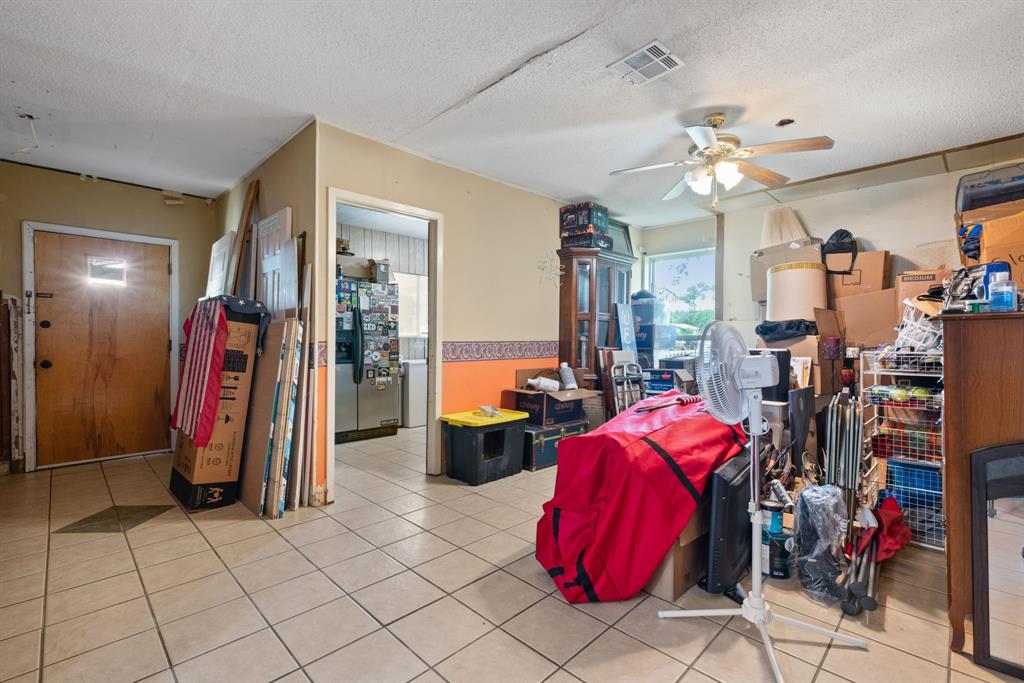 2200 Southeast 26th Avenue Mineral Wells, TX 76067 - Photo 21 of 28 a view of a livingroom with furniture and a chandelier