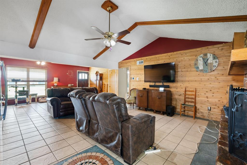 2200 Southeast 26th Avenue Mineral Wells, TX 76067 - Photo 6 of 28 a living room with furniture and a flat screen tv