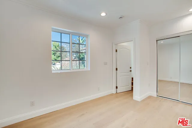 a bathroom with a double vanity sink mirror and shower