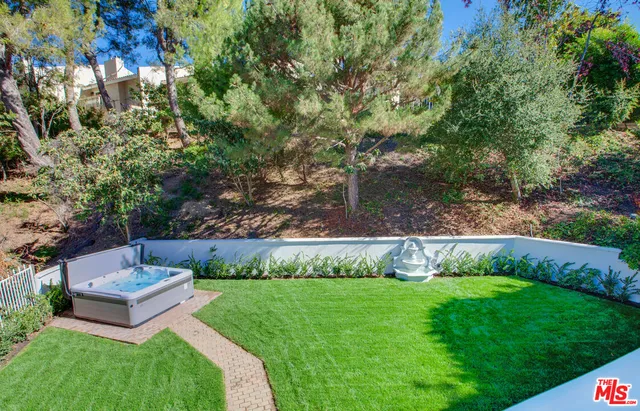 a bathroom with a granite countertop sink a toilet and a bathtub