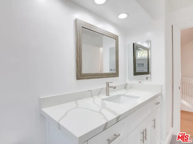 a picture of a bathroom with a shower