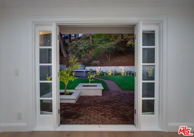 a kitchen with cabinets and stainless steel appliances