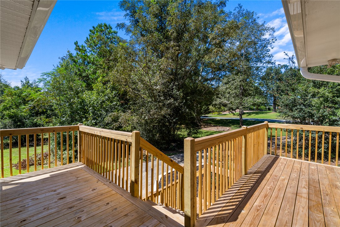 208 Williamsburg Road Anderson, SC 29621 - Photo 44 of 48 Mature trees frame the verdant view from this elevated wooden deck.