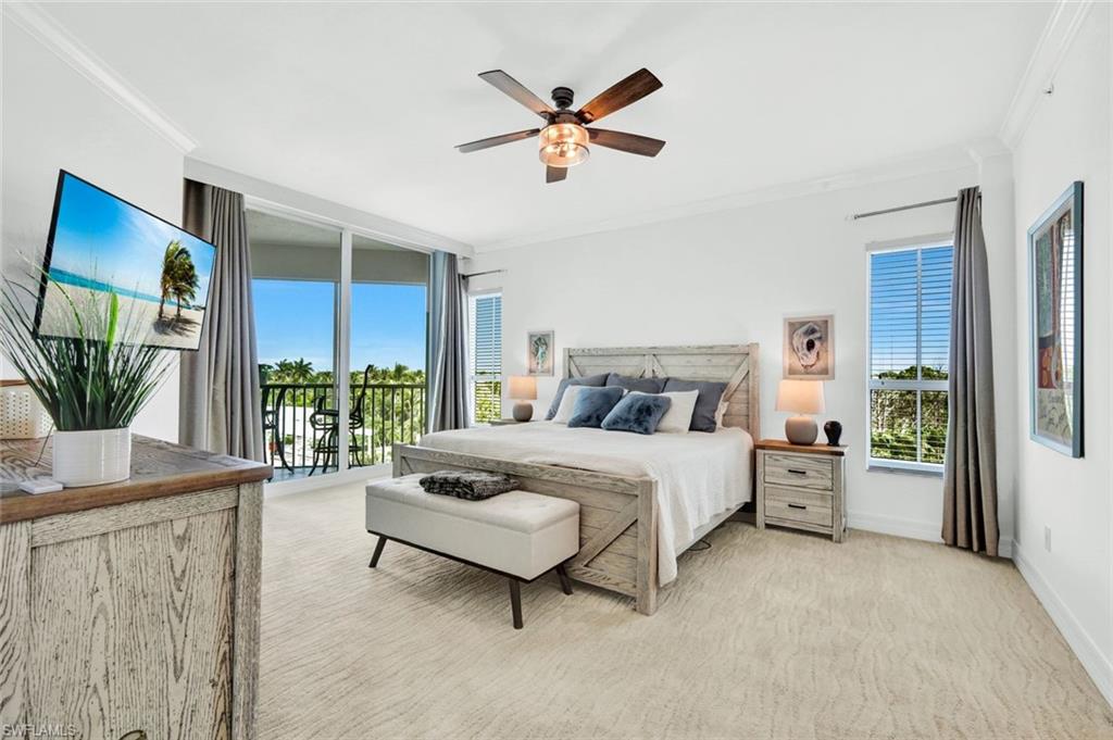 295 Grande Way, Unit 306 Naples, FL 34110 - Photo 20 of 48 a bed room with a bed and a large window