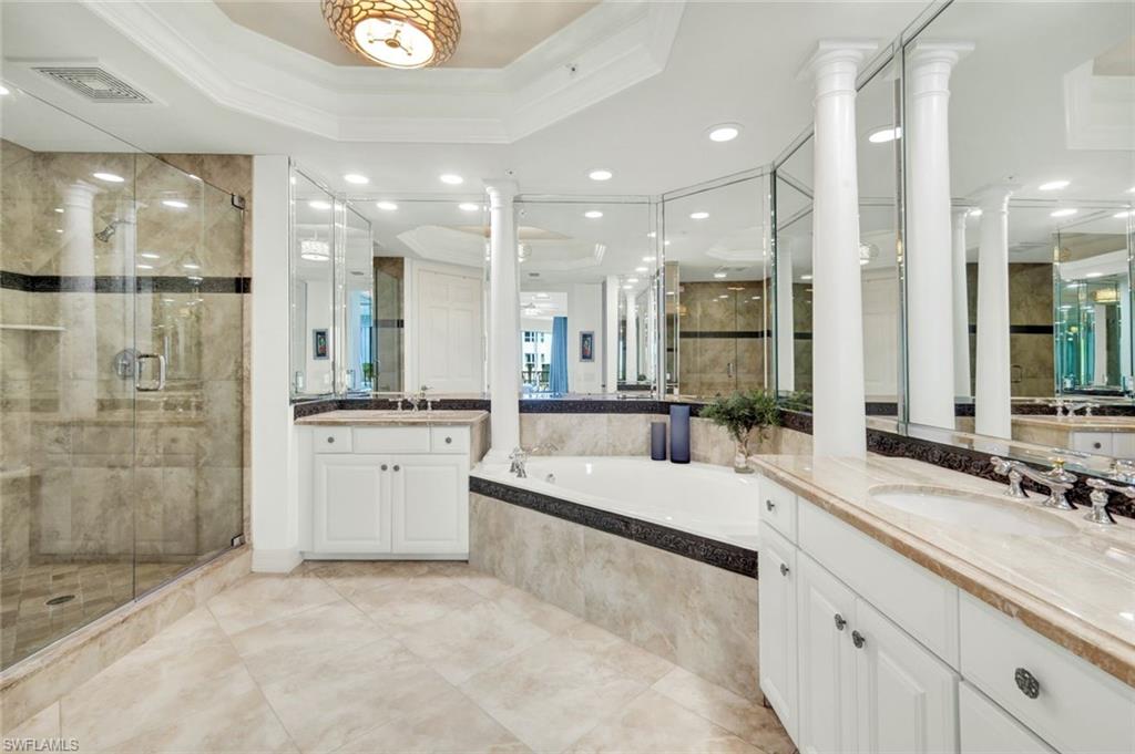 295 Grande Way, Unit 306 Naples, FL 34110 - Photo 22 of 48 a large white kitchen with a large tub and sink