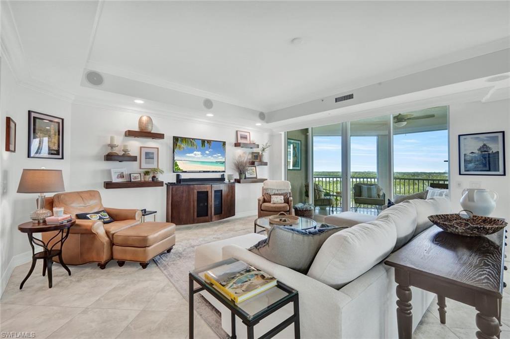 295 Grande Way, Unit 306 Naples, FL 34110 - Photo 3 of 48 a living room with furniture kitchen view and a large window