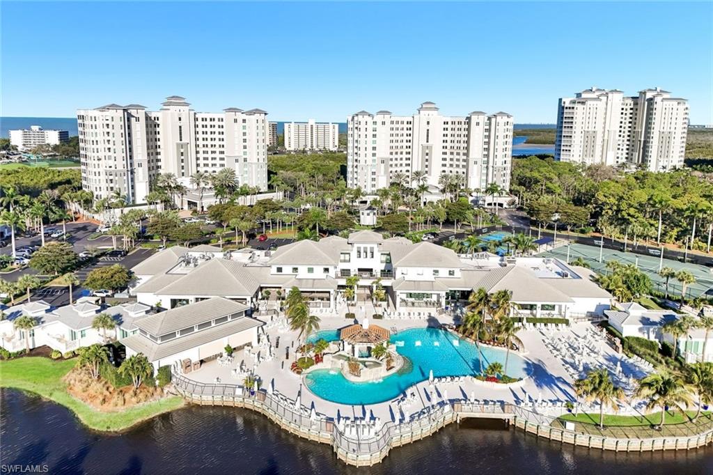 295 Grande Way, Unit 306 Naples, FL 34110 - Photo 32 of 48 a picture of a city with tall buildings