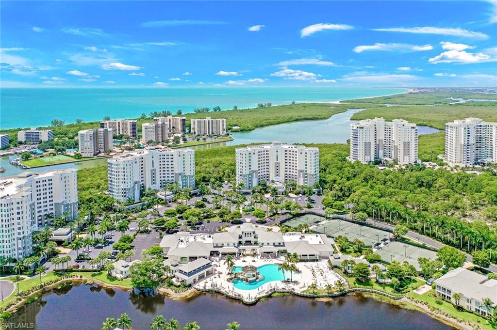 295 Grande Way, Unit 306 Naples, FL 34110 - Photo 48 of 48 a view of a city with tall buildings
