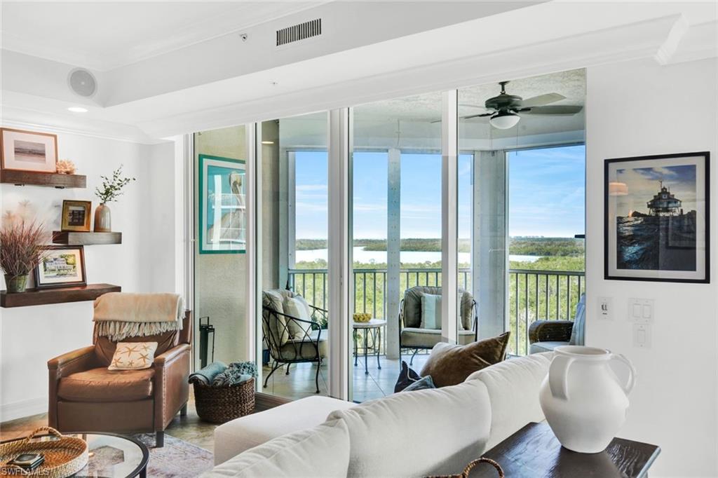 295 Grande Way, Unit 306 Naples, FL 34110 - Photo 5 of 48 a living room with furniture and a window