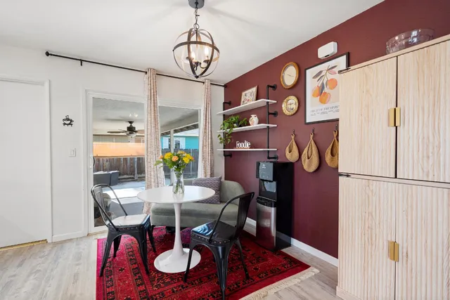 a view of a dining room with furniture window and wooden floor