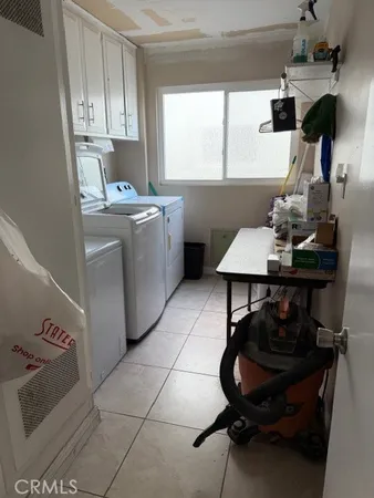 a kitchen with a sink cabinets and window
