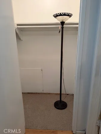 a spacious bathroom with a granite countertop sink and a mirror