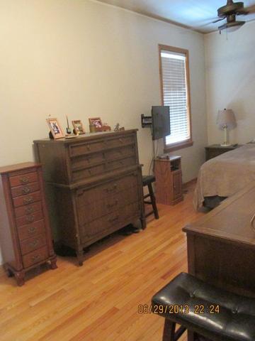 2829 South Lowe Avenue Chicago, IL 60616 - Photo 6 of 11 a bedroom with a bed and a window