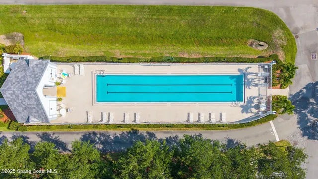 a view of a swimming pool with an outdoor space and seating area