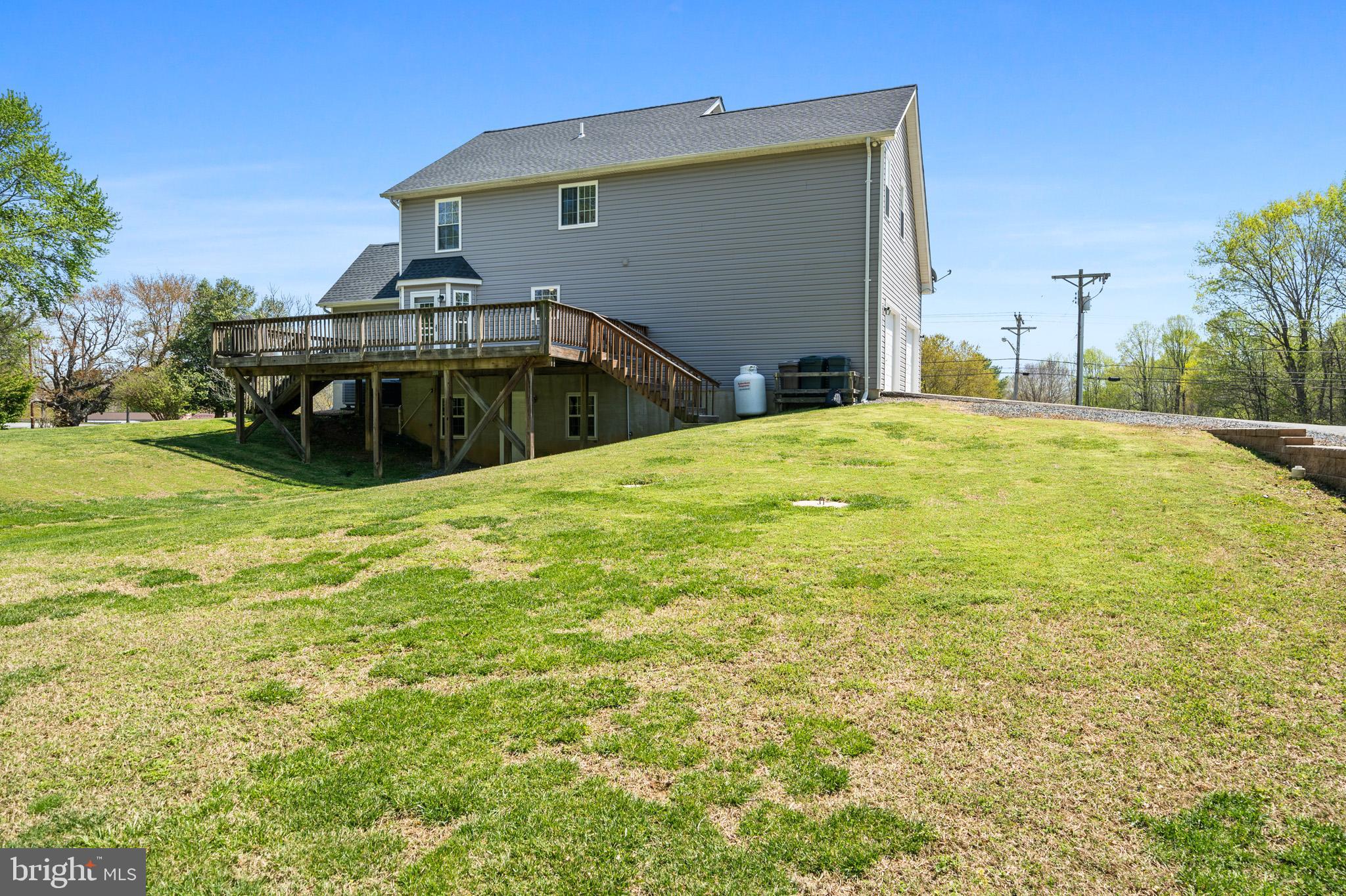 1230 Plum Point Road Huntingtown, MD 20639 - Photo 12 of 79 a view of a backyard with a garden and entertaining space
